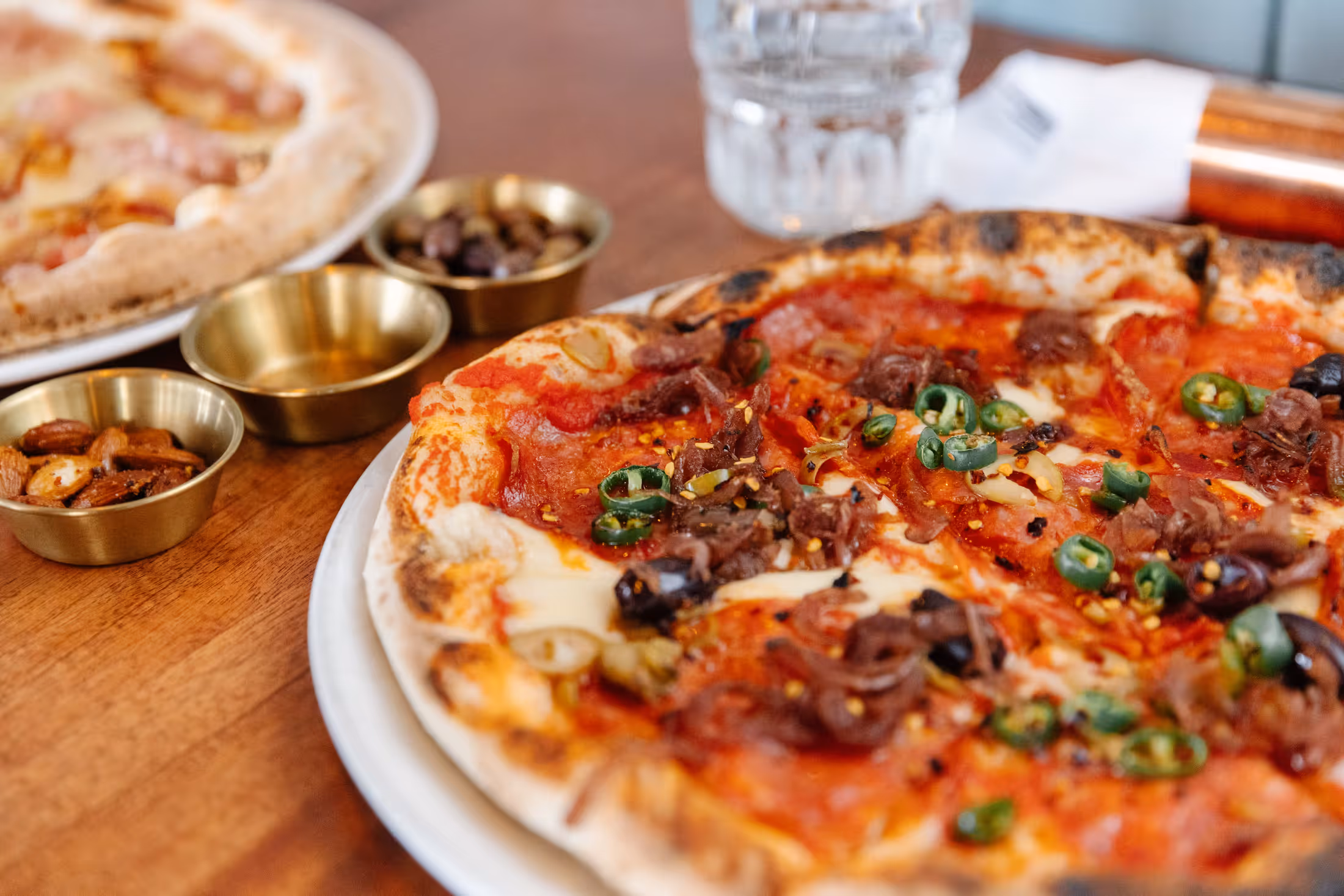 Close-up pizza with toppings on table